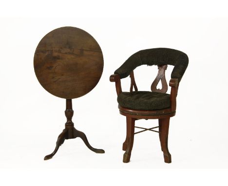A small mahogany circular tripod table, together with a later 19th century horseshoe backed railwayman's chair (2)
