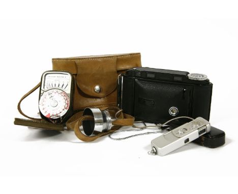 A Voigtlander Bessa Rangefinder camera and case, a Minox camera, cased, and a Weston Master and Light meter