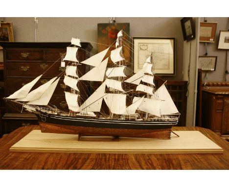 A 20th century model of the Cutty Sark, in oak and perspex display case, together with a gilt metal commemorative watch, 120c