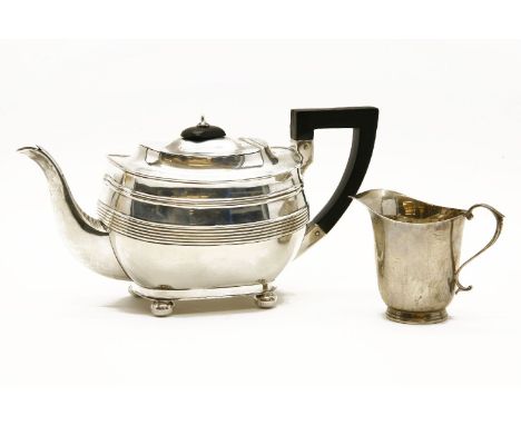 A silver Harrison Brothers and George Howson of Sheffield tea pot, 1925, together with a silver cream jug, Birmingham, 1925