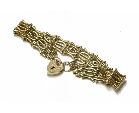 A 9ct gold five row gate link bracelet with padlock, two pairs of curved link between a straight link amethyst set with betwe