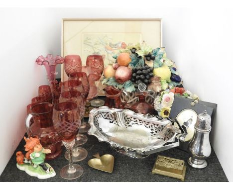 A quantity of cranberry glassware to include six wine glasses, a goebel figure, two large fruit basket ornaments, etc