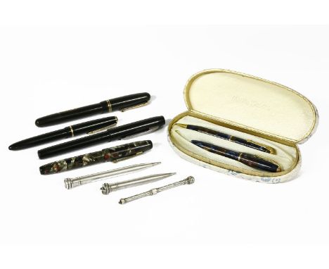 A collection of pens and pencils, to include a sterling silver articulated pencil and another with purple paste finial, a Con