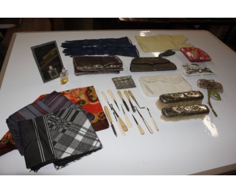 A box containing various vintage gloves, purses, and scarves 