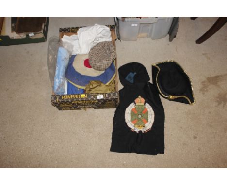 A box containing a Harrods purse, vintage school hat etc.