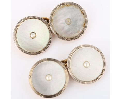 A pair of Art Deco 9ct rose gold mother-of-pearl cufflinks, circular panels with central split pearls, panel diameter 13.9mm,