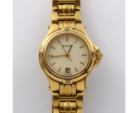 GUCCI - a lady's gold plated 9240L quartz bracelet watch, cream dial with gilded baton hour markers, sweep centre seconds han