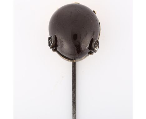 An Antique garnet and diamond hat pin, unmarked gold settings with pear cabochon garnet and rose-cut diamonds, hat pin head h