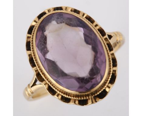 A late 20th century 9ct gold amethyst dress ring, set with oval mixed-cut amethyst, hallmarks London 1973, setting height 17.