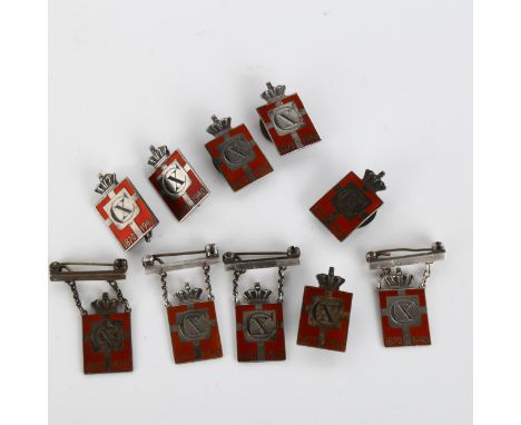 GEORG JENSEN - 10 Danish silver and red enamel Kingmark badges and brooches, height 24.1mm, 36.6g totalNo damage or repairs, 