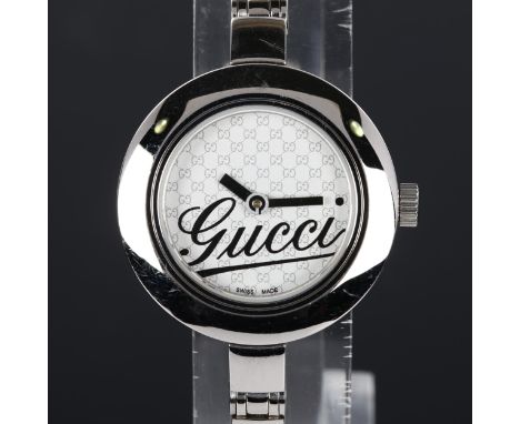 GUCCI - a lady's stainless steel quartz bracelet watch, ref. 105, Gucci GG monogram dial with bangle bracelet, serial no. 131