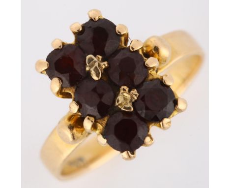 An 18ct gold Bohemian garnet dress ring, set with round-cut garnets, setting height 11.8mm, size I, 2.9gNo damage or repairs,