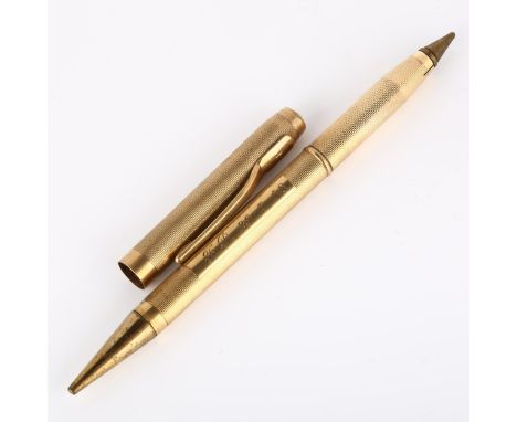 A mid-20th century 9ct gold combination propelling pencil/ballpoint pen, engine turned case with 9ct clip, maker's marks SJR,
