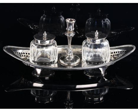 A late Victorian silver double-inkwell and taper stick desk stand, oval form with reeded and lattice pierced rim and fitted f