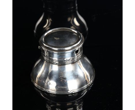 An Edwardian silver combination inkwell/pocket watch stand, with ceramic liner, by Henry Matthews, hallmarks Birmingham 1904,