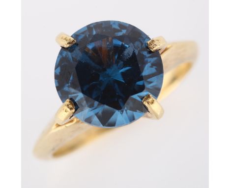 A late 20th century Continental 9ct gold synthetic blue spinel dress ring, setting height 12.6mm, size K, 3.7g2 prongs are be