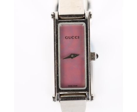 GUCCI - a lady's stainless steel 1500L quartz bracelet watch, pink mother-of-pearl dial with cabochon crown and bangle bracel