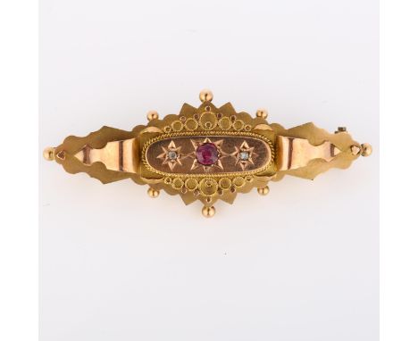 An early 20th century 9ct rose gold Etruscan Revival brooch, set with round-cut ruby and rose-cut diamonds, maker's marks TH,