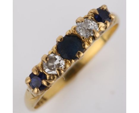 An early/mid-20th century 18ct gold graduated five stone sapphire and diamond half hoop ring, setting height 4.6mm, size O, 2