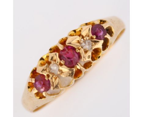 An early 20th century 18ct gold graduated five stone ruby and diamond half hoop ring, maker's marks FG, hallmarks Chester 190