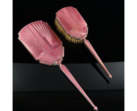 An Art Deco silver and pink enamel 2-piece dressing table set, comprising hand mirror and hair brush, by Charles S Green & Co