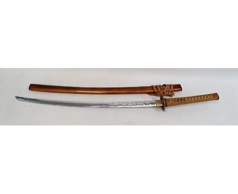 Modern Japanese Katana sword with shagreen-effect hilt, the tsuba with pierced dragon decoration, the blade with engraved dra