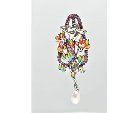 A WHITE METAL PLIQUE A JOUR AND GEM SET BROOCH, of Art Nouveau design, the figure surrounded by foliate enamel and pink sapph