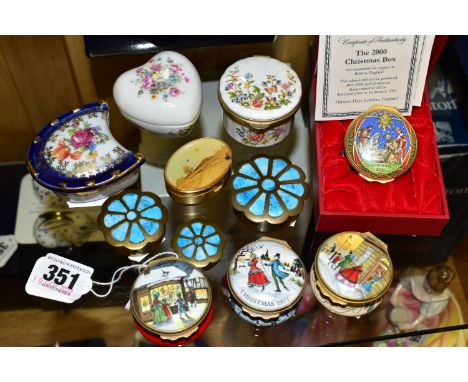 A GROUP OF TRINKET BOXES, to include a boxed Halcyon Days Christmas 2000 enamel trinket box, three Bilston &amp; Battersea En