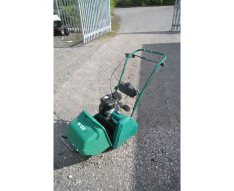 A SUFFOLK PUNCH 14S CYLINDER PETROL LAWNMOWER, with grass box (engine turns)