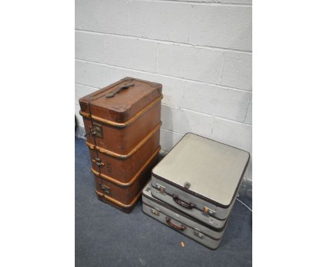 A VINTAGE TRAVELLING TRUNK, and two graduated rev robe cases (3)
