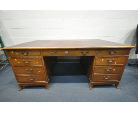 SHAPLAND AND PETTER LTD OF BARNSTAPLE, AN EARLY TO MID 20TH CENTURY MAHOGANY PEDESTAL DESK, with a brown leather writing surf