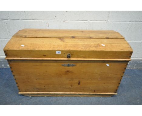 A LATE 19TH EARLY 20TH CENTURY PINE DOME TOP TRUNK, with twin iron handles, length 92cm x depth 50cm x height 58cm (condition