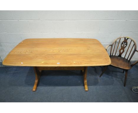 AN ERCOL BLONDE ELM TABLE, on trestle legs, length 153cm x depth 58cm x height 74cm (condition:-poorly refurbished top) an Er
