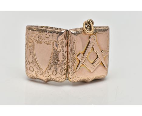 A YELLOW METAL MASONIC LOCKET, the rectangular locket with embossed compass and set square motif, with cartouche to the rever
