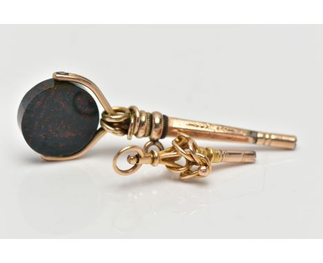 TWO YELLOW METAL WATCH KEYS, the first designed as a circular bloodstone swivel panel, suspended from an openwork surmount, w