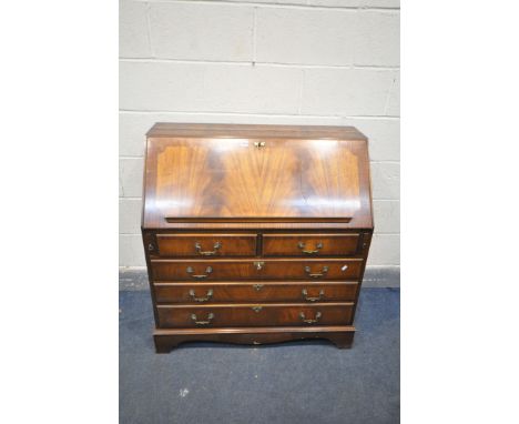 A LATE 20TH CENTURY MAHOGANY BUREAU, with a fitted interior, over two short and three long drawers, on bracket feet, width 96