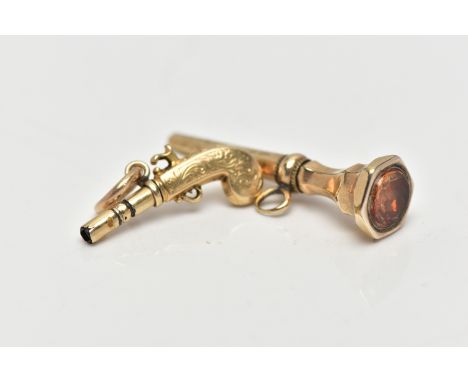 TWO YELLOW METAL NOVELTY WATCH KEYS, the first designed as a pistol gun, unmarked yellow metal, approximate length 25mm, the 