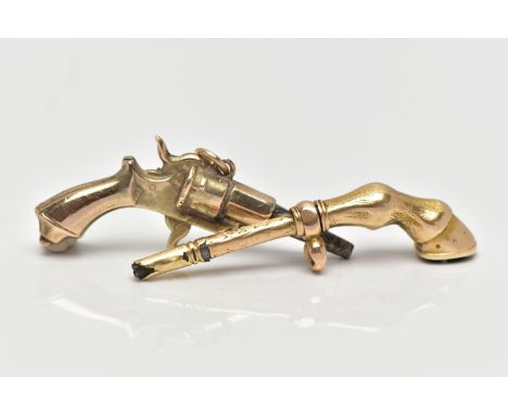 TWO YELLOW METAL NOVELTY WATCH KEYS, the first designed as a revolver gun, unmarked yellow metal, approximate length 40mm, th