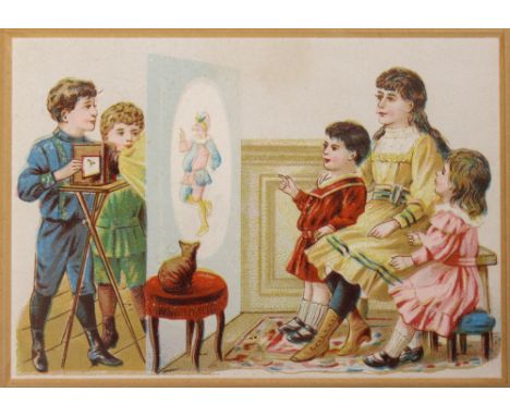 A late 19th century trade card of children playing with magic lantern. Publisher unknown,  circa 1890s; 11 x 7.5 cm, mounted 