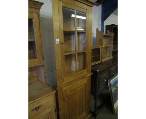 MODERN OAK FRAMED FLOOR STANDING CORNER CUPBOARD WITH SINGLE GLAZED DOOR OVER PANELLED DOOR WITH TURNED KNOB HANDLES 