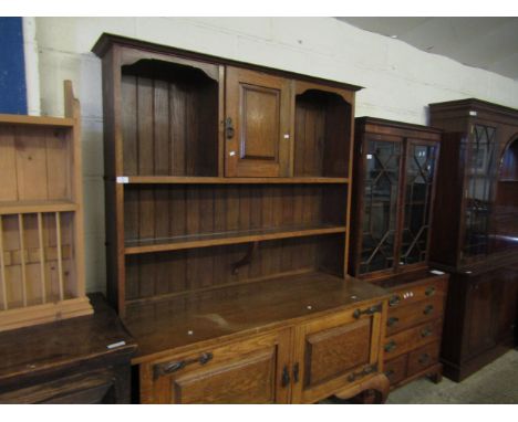 ARTS &amp; CRAFTS DRESSER, THE TOP FITTED WITH SINGLE CUPBOARD DOOR WITH TWO OPEN SHELVES, THE BASE FITTED WITH TWO CUPBOARD 