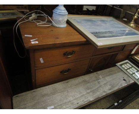VICTORIAN WAXED PINE DRESSER BASE FITTED WITH SEVEN DRAWERS OVER A PANELLED CUPBOARD DOOR WITH BRASS SWAN NECK HANDLES 