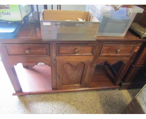 EASTERN HARDWOOD DRESSER BASE WITH THREE DRAWERS WITH CENTRAL CUPBOARD DOOR WITH OPEN SHELVES AND BRASS KNOB HANDLES 