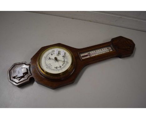 AN EARLY 20TH CENTURY OAK CASED BAROMETER