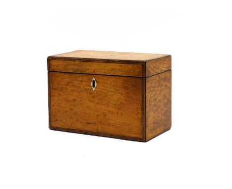 An early 19th century satinwood veneered tea caddy, with crossbanding and stringing, the top with painted initals 'TMJ', the 