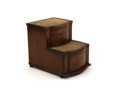 A set of George III mahogany bow front bed steps, the top tier with a hinged lid, the lower pull-out tier also with a hinged 