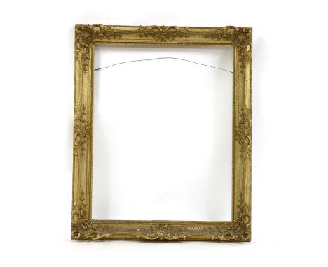 A 19th century gilt gesso scroll moulded and swept portrait frame, sight size, 96 x 77cm, overall size, 120 x 98cmCondition r