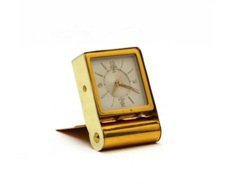A Jaeger-LeCoultre eight day travelling clock, having white dial and arabic numerals, 7cm high when open, 9cm longCondition r