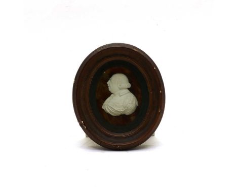 A 19th century oval plaster miniature portrait bust, possibly of George lll, in a faux wood plaster frame. 18cm high overallC