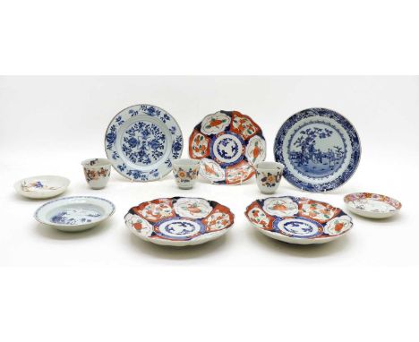 A group of three Japanese Imari plates, each with typical decoration, 21.5cm diameter, together with three Imari cups, 7cm hi